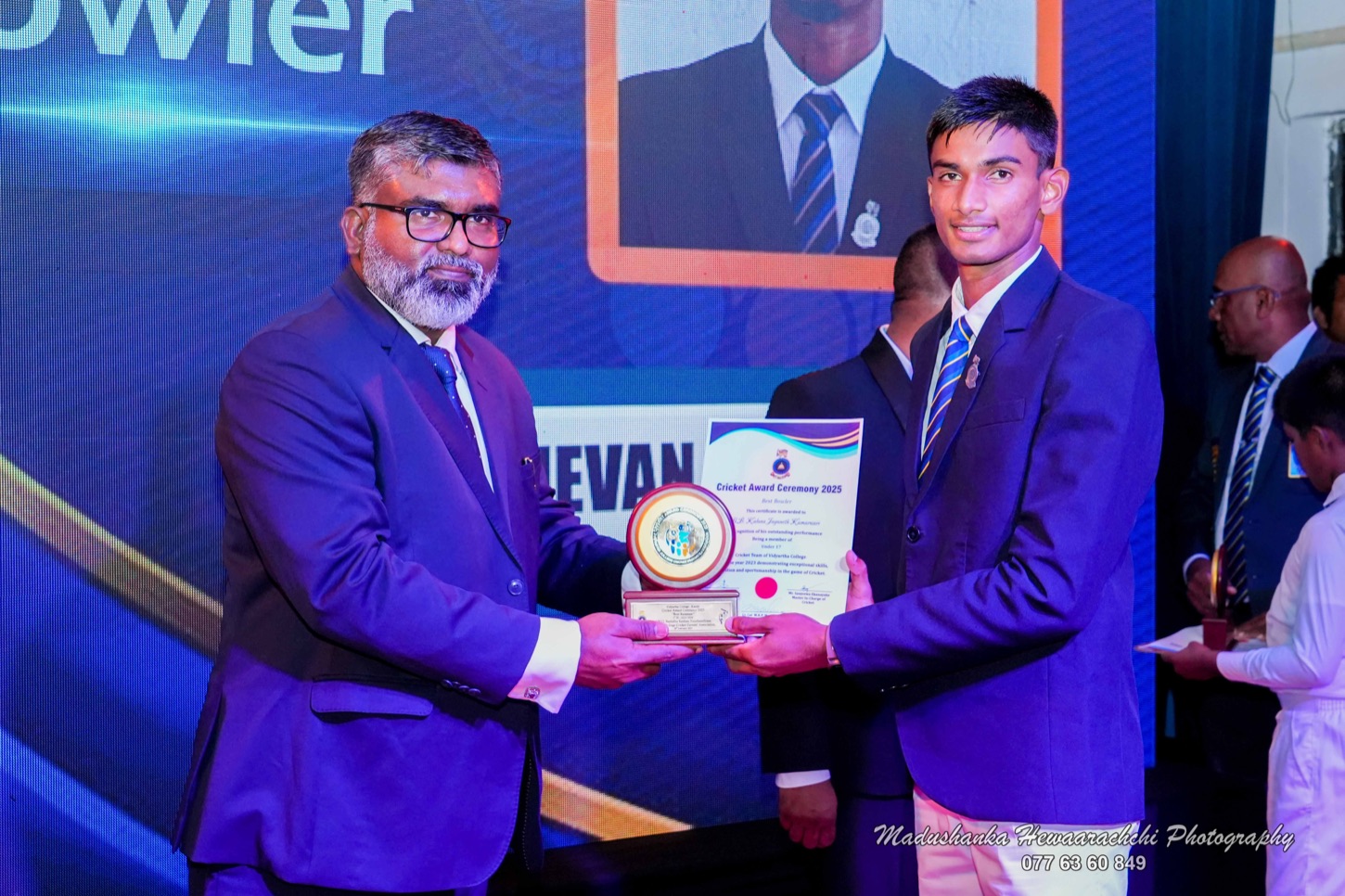 Lakmal Sameera De Silva presenting an award at a community event